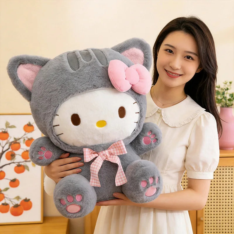 Peluche gatita gris con lazo en brazos
