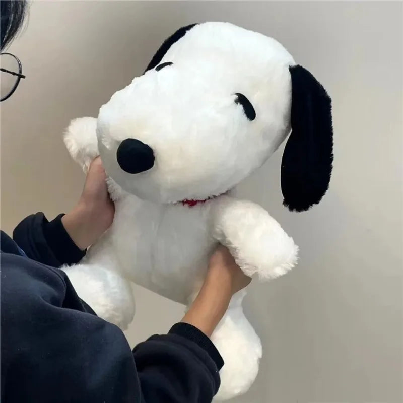 Peluche perrito blanco de 25 cm en brazos